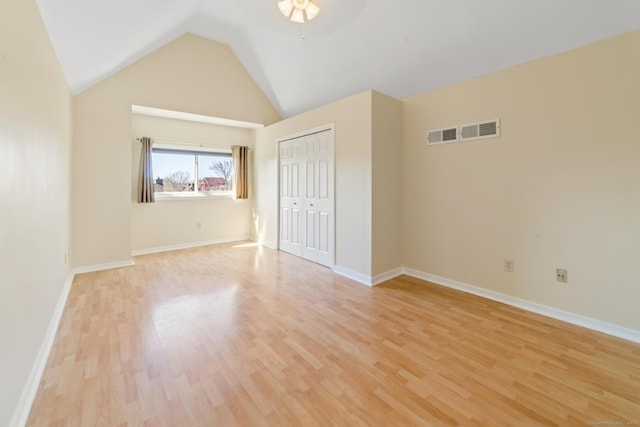 72 Montoya Dr Unit 72, Branford, CT 06405 - unfurnished bedroom featuring light wood finished floors, visible vents, a closet, and lofted ceiling