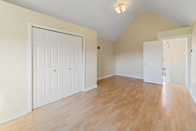 72 Montoya Dr Unit 72, Branford, CT 06405 - unfurnished bedroom featuring vaulted ceiling, a closet, light wood finished floors, baseboards, and visible vents