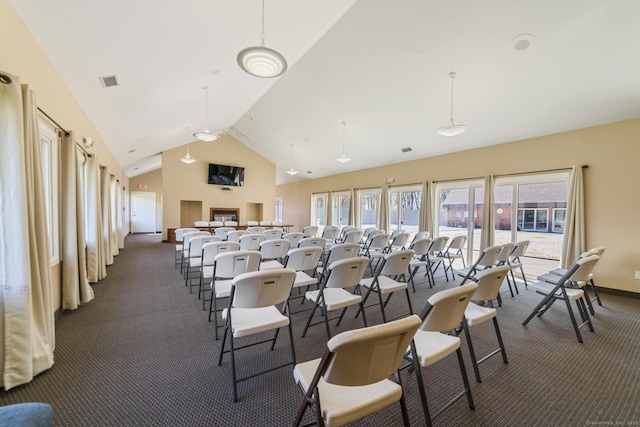 72 Montoya Dr Unit 72, Branford, CT 06405 - miscellaneous room with dark carpet, baseboards, visible vents, and high vaulted ceiling