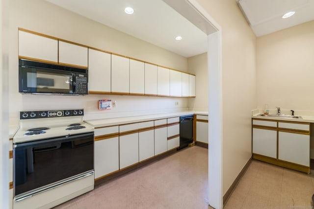 72 Montoya Dr Unit 72, Branford, CT 06405 - kitchen featuring a sink, recessed lighting, white cabinetry, light countertops, and black appliances