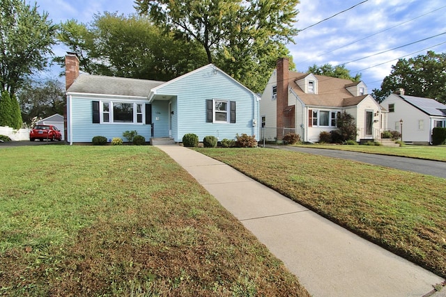 136 Edgemere Ave, West Hartford, CT 06110 - view of front of property featuring a chimney and a front yard