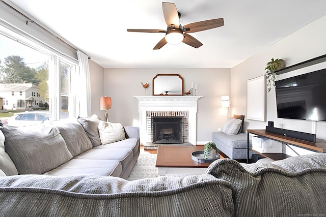 136 Edgemere Ave, West Hartford, CT 06110 - living area featuring wood finished floors, a ceiling fan, and a brick fireplace