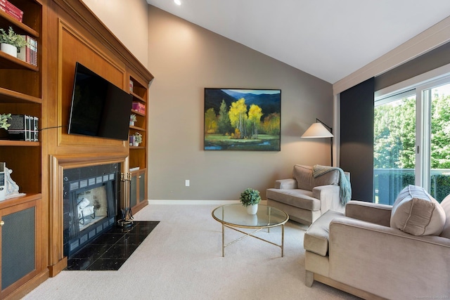living area with carpet, a fireplace, lofted ceiling, and baseboards