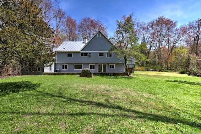 472 Westover Rd, Stamford, CT 06902 - back of house featuring a lawn and metal roof