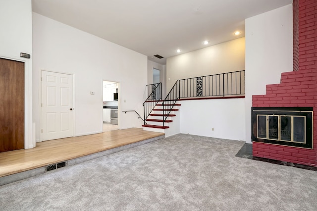 472 Westover Rd, Stamford, CT 06902 - unfurnished living room with recessed lighting, visible vents, carpet flooring, and stairs