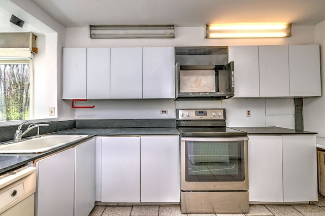 472 Westover Rd, Stamford, CT 06902 - kitchen with dark countertops, a sink, and stainless steel range with electric stovetop