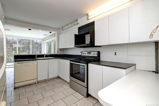 472 Westover Rd, Stamford, CT 06902 - kitchen featuring stainless steel electric stove, dark countertops, dishwasher, and white cabinetry