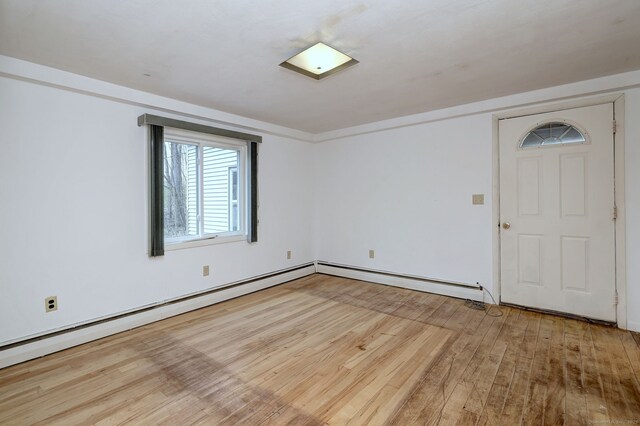 472 Westover Rd, Stamford, CT 06902 - empty room featuring baseboard heating and light wood-style floors
