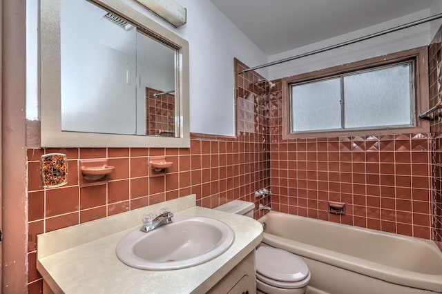 472 Westover Rd, Stamford, CT 06902 - full bathroom with tile walls, vanity, shower / tub combination, and toilet