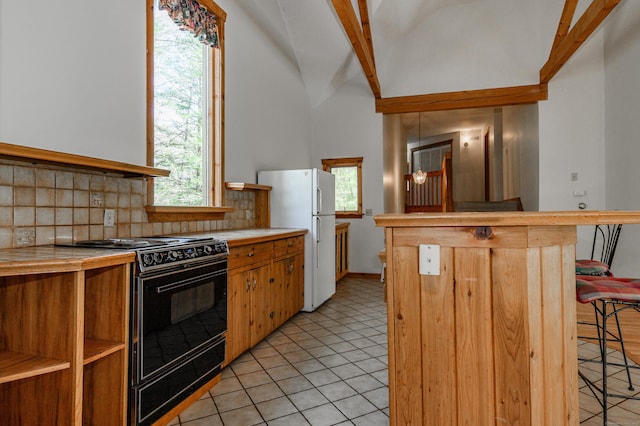 9 Stonehedge Way, Granby, CT 06060 - kitchen with light countertops, a kitchen breakfast bar, freestanding refrigerator, black / electric stove, and tasteful backsplash