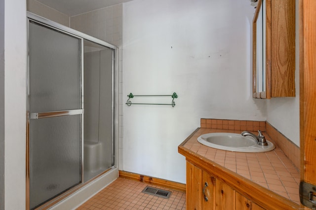 9 Stonehedge Way, Granby, CT 06060 - full bath with tile patterned floors, visible vents, a shower stall, and a sink