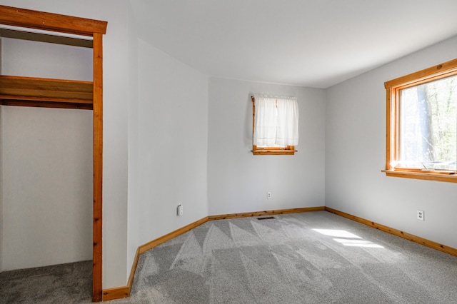 9 Stonehedge Way, Granby, CT 06060 - unfurnished bedroom featuring baseboards, multiple windows, and carpet