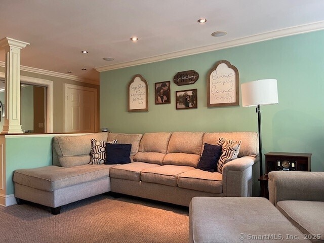 carpeted living room with crown molding, ornate columns, and recessed lighting