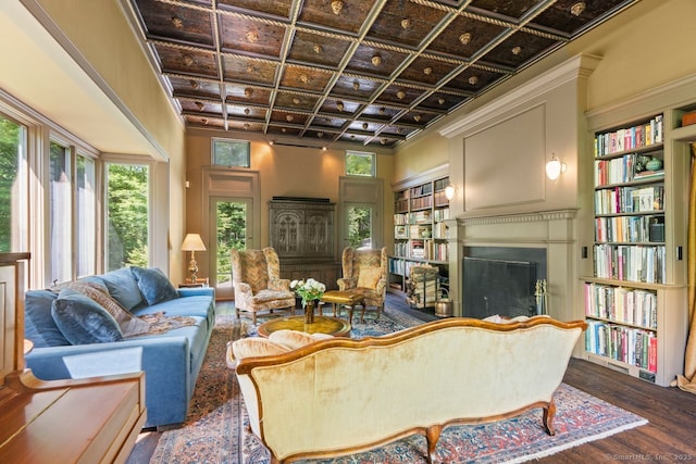 66 Hedlund Rd, East Haddam, CT 06423 - living area featuring a fireplace, wood finished floors, coffered ceiling, and crown molding