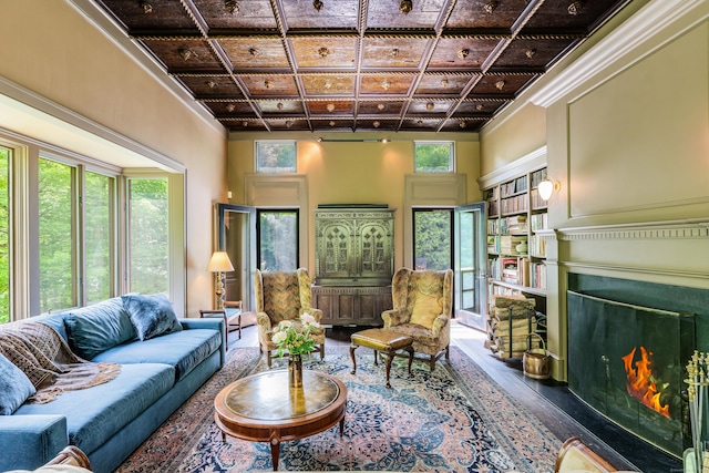 66 Hedlund Rd, East Haddam, CT 06423 - living room featuring a fireplace with flush hearth, wood finished floors, coffered ceiling, and ornamental molding