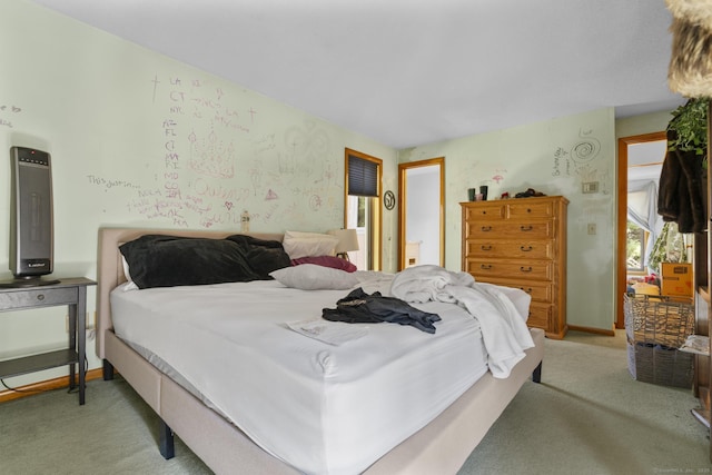 bedroom featuring light colored carpet
