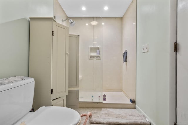 full bathroom featuring recessed lighting, a stall shower, and toilet