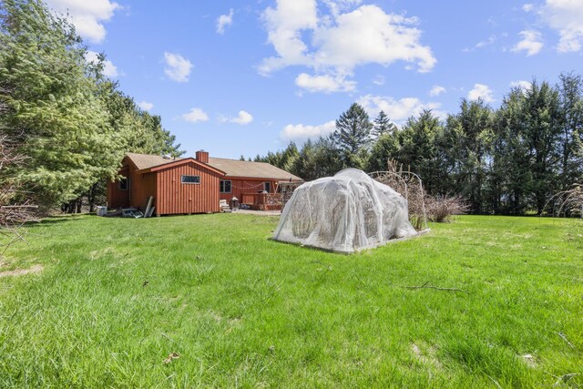 view of yard with a wooden deck