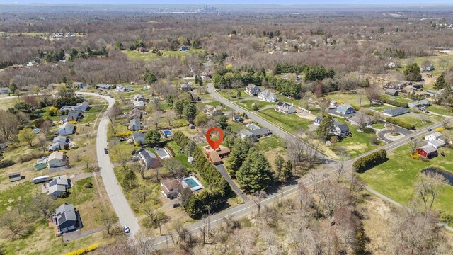 birds eye view of property featuring a residential view and a view of trees