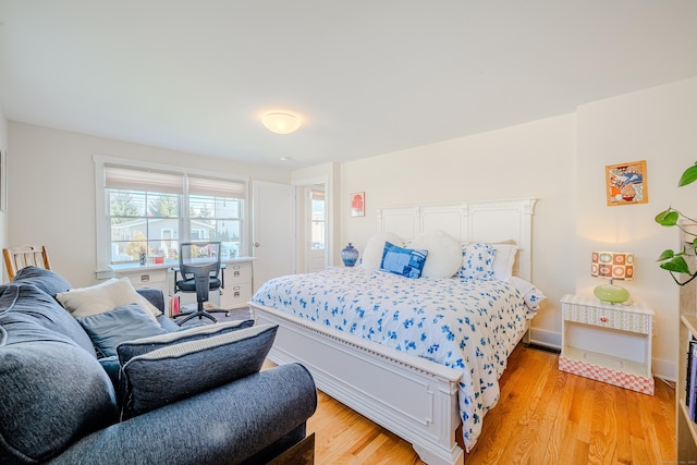 bedroom with light wood finished floors