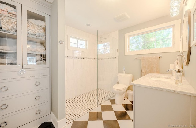 full bath with toilet, a walk in shower, and a wealth of natural light