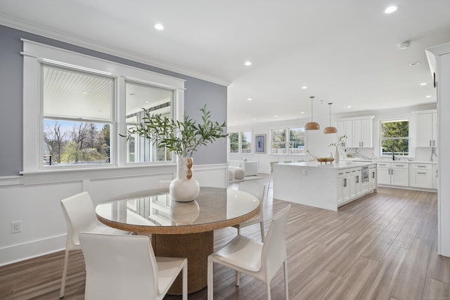 433 Belden Hill Rd, Wilton, CT 06897 - dining room with plenty of natural light, crown molding, recessed lighting, light wood-type flooring, and wainscoting
