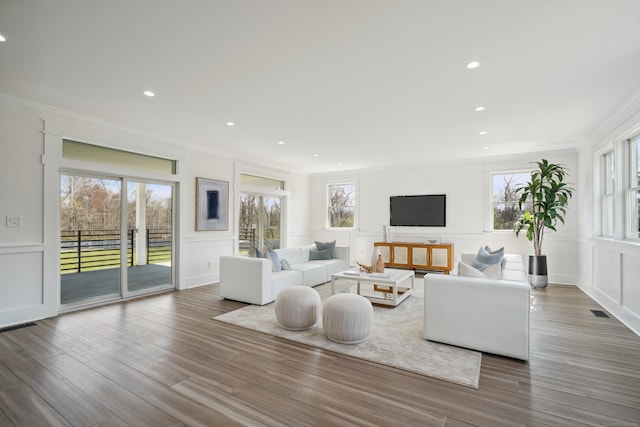 433 Belden Hill Rd, Wilton, CT 06897 - living area with a decorative wall, ornamental molding, wood finished floors, wainscoting, and recessed lighting