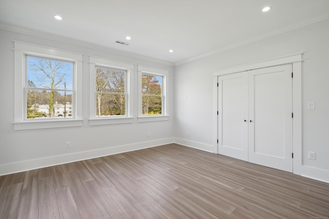 433 Belden Hill Rd, Wilton, CT 06897 - unfurnished bedroom with crown molding, wood finished floors, baseboards, recessed lighting, and a closet