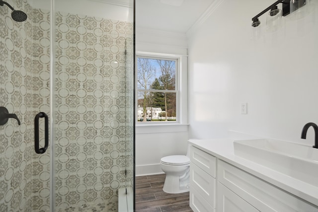 433 Belden Hill Rd, Wilton, CT 06897 - bathroom with a tile shower, crown molding, wood finished floors, toilet, and vanity