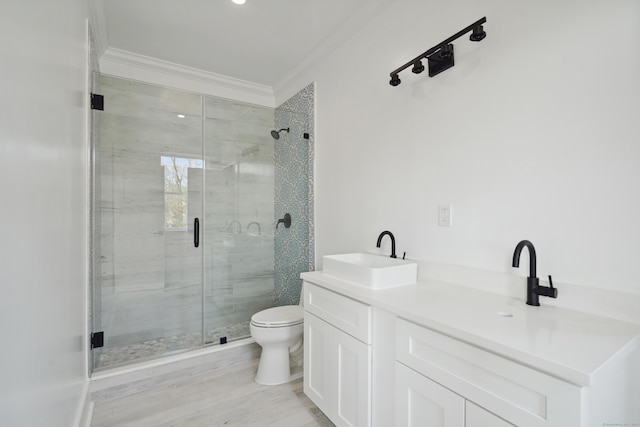 433 Belden Hill Rd, Wilton, CT 06897 - bathroom featuring a stall shower, toilet, ornamental molding, double vanity, and wood finished floors