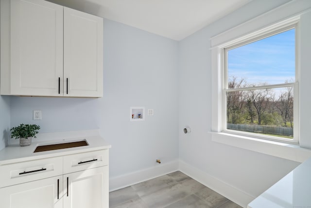 433 Belden Hill Rd, Wilton, CT 06897 - washroom with cabinet space, baseboards, and hookup for a washing machine