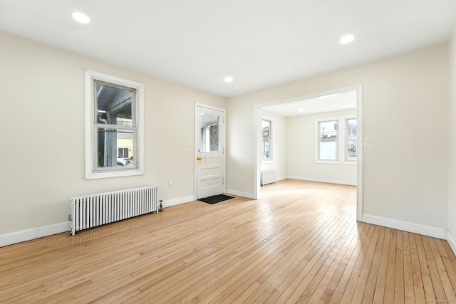 576 Main St, Somers, CT 06071 - empty room featuring radiator, radiator heating unit, light wood-style flooring, and baseboards
