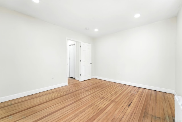 576 Main St, Somers, CT 06071 - empty room with radiator, recessed lighting, light wood-style flooring, and baseboards
