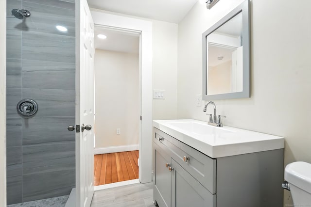 576 Main St, Somers, CT 06071 - bathroom with baseboards, wood finished floors, toilet, and vanity