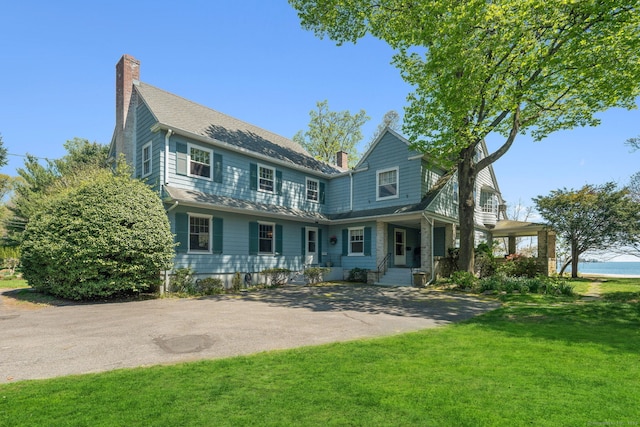 86 Wallacks Dr, Stamford, CT 06902 - view of front of home with a chimney and a front lawn