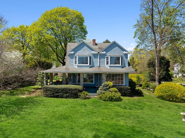 86 Wallacks Dr, Stamford, CT 06902 - shingle-style home with a porch, a chimney, and a front lawn