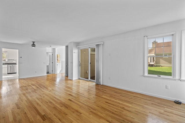 75 Brittania Rd Unit 75, Danbury, CT 06811 - unfurnished living room featuring baseboards, light wood-style flooring, and ceiling fan