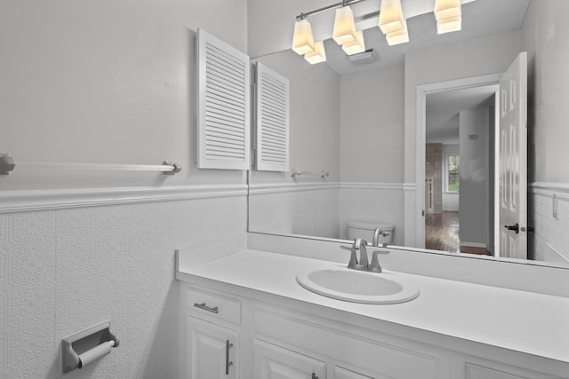 75 Brittania Rd Unit 75, Danbury, CT 06811 - bathroom with vanity, toilet, and a wainscoted wall