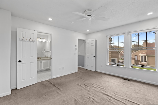 75 Brittania Rd Unit 75, Danbury, CT 06811 - unfurnished bedroom featuring carpet flooring, recessed lighting, baseboards, and visible vents