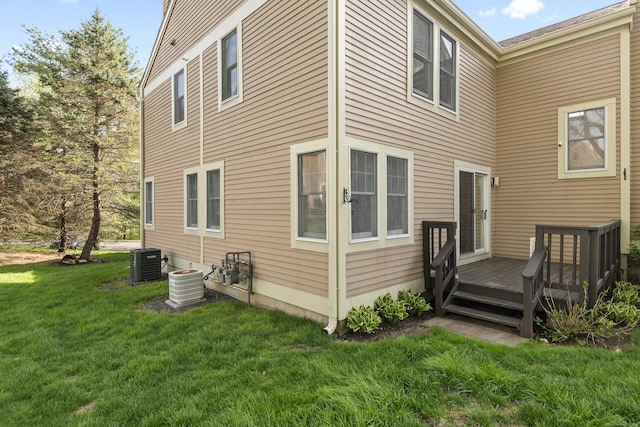 75 Brittania Rd Unit 75, Danbury, CT 06811 - rear view of property with a lawn, a wooden deck, and central AC