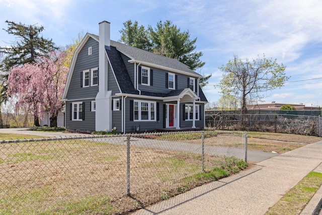 60 Mill St, New Britain, CT 06051 - dutch colonial featuring roof with shingles, a fenced front yard, and a chimney