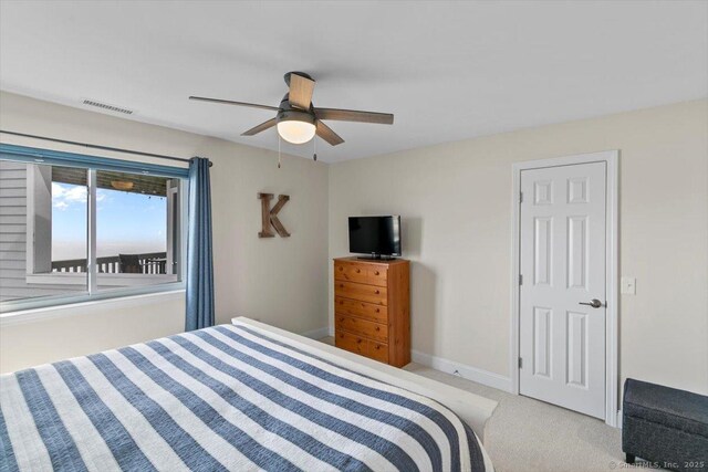 bedroom featuring carpet floors, baseboards, ceiling fan, and visible vents