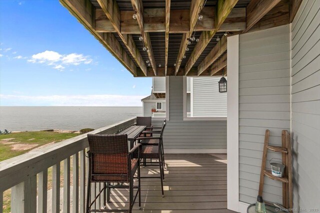 balcony featuring a water view