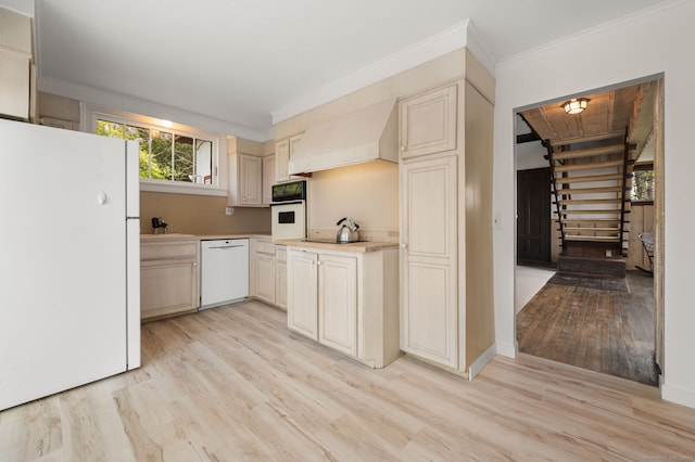 302 Ferry Rd, Old Lyme, CT 06371 - kitchen with white appliances, light wood-type flooring, light countertops, ornamental molding, and a sink