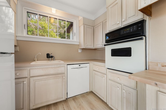 302 Ferry Rd, Old Lyme, CT 06371 - kitchen with white appliances, a sink, crown molding, and light wood finished floors