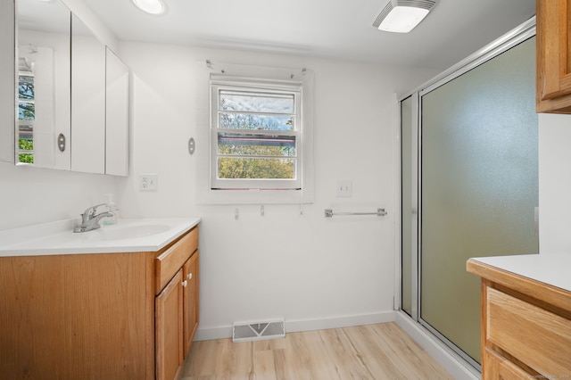302 Ferry Rd, Old Lyme, CT 06371 - bathroom featuring vanity, a shower stall, and wood finished floors