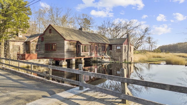55-69 Sawmill Rd, Branford, CT 06405 - exterior space with a water view, a shingled roof, and a chimney