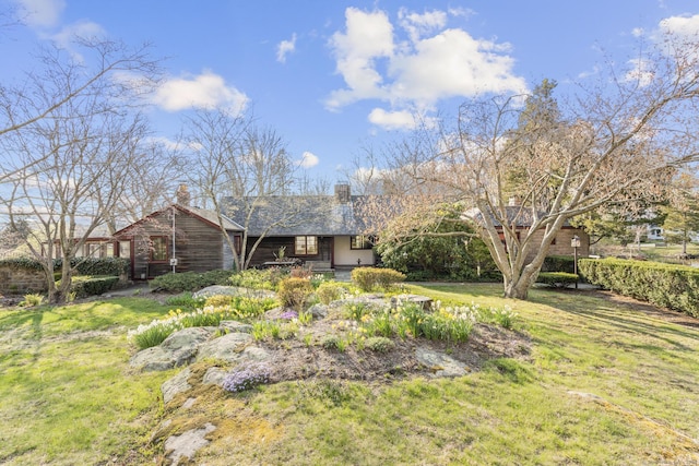 55-69 Sawmill Rd, Branford, CT 06405 - view of front of home with a chimney and a front yard