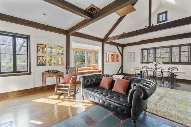 55-69 Sawmill Rd, Branford, CT 06405 - living room with beam ceiling, baseboards, wood finished floors, and high vaulted ceiling
