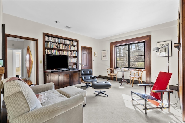 55-69 Sawmill Rd, Branford, CT 06405 - carpeted living room featuring baseboards and visible vents